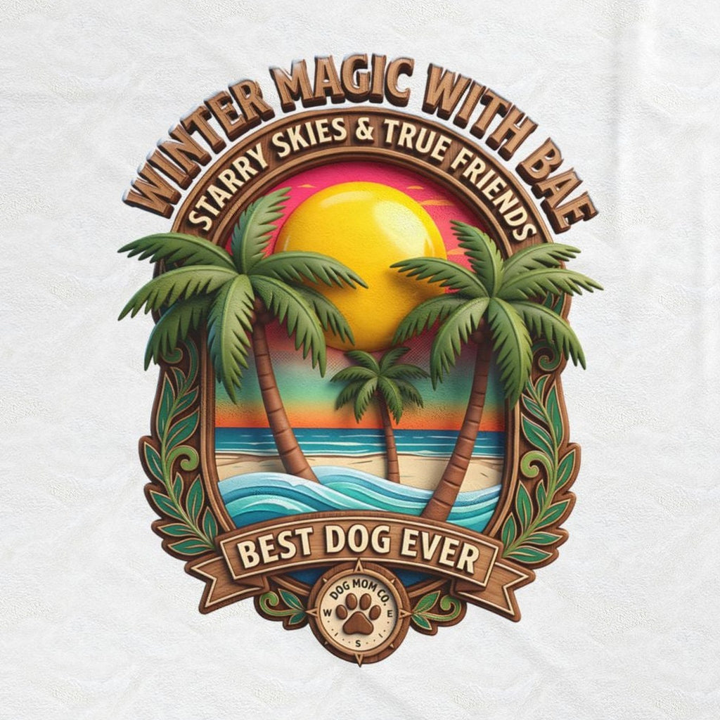 Close-up of the Best Dog Ever print: golden sun, green palms, and turquoise waves inside a carved badge, on the white velveteen throw